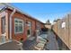 Spacious backyard with patio, grill, and well maintained brick exterior at 3835 N Raleigh St, Denver, CO 80212