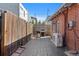 Backyard with patio, brick walls, grill, and privacy fence perfect for outdoor living at 3835 N Raleigh St, Denver, CO 80212