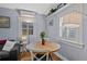 Dining area featuring a wood table, seating for four, and bright window providing natural light at 3835 N Raleigh St, Denver, CO 80212