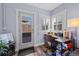 Bright office space with a corner desk, natural light, and a view to the backyard at 3835 N Raleigh St, Denver, CO 80212