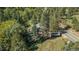 Secluded home surrounded by towering trees and lush greenery at 25728 Stanley Park Rd, Evergreen, CO 80439