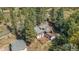 Beautiful residence nestled in the lush woods with an expansive deck and outdoor seating at 25728 Stanley Park Rd, Evergreen, CO 80439