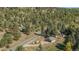 Scenic wooded property with a long driveway leading to the lovely home at 25728 Stanley Park Rd, Evergreen, CO 80439