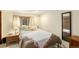 This bedroom features a comfortable bed, side tables and a large mirror at 25728 Stanley Park Rd, Evergreen, CO 80439
