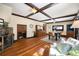 Cozy dining room featuring hardwood floors, a fireplace, and custom built-in cabinetry at 25728 Stanley Park Rd, Evergreen, CO 80439