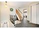 Inviting foyer features stone floors, coat closet, and staircase to the second floor at 25728 Stanley Park Rd, Evergreen, CO 80439