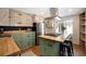 Bright and airy kitchen featuring butcher block island with gas cooktop and stainless steel appliances at 25728 Stanley Park Rd, Evergreen, CO 80439