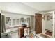 Cozy office space with built-in seating, a unique wooden door and ample natural light at 25728 Stanley Park Rd, Evergreen, CO 80439