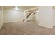 Spacious finished basement with carpeted floor and stairs at 12870 W Grand Pl, Morrison, CO 80465