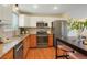 Modern kitchen with stainless steel appliances at 12870 W Grand Pl, Morrison, CO 80465