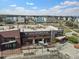 Exterior aerial view of brewery with Belgian-inspired ales, tables, and the neighborhood's modern architecture at 2110 W 67Th Pl, Denver, CO 80221