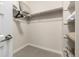 Walk-in closet with ample shelving provides organized storage and convenience at 2110 W 67Th Pl, Denver, CO 80221