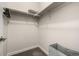 Bright walk-in closet with neutral walls, carpet, and a shelf with a hanging rod for optimal storage at 2110 W 67Th Pl, Denver, CO 80221