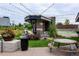 Community space with outdoor seating, landscaping, modern architecture and a covered patio area at 2110 W 67Th Pl, Denver, CO 80221