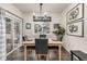 Dining area features hardwood floors, modern chandelier, and sliding glass door at 2110 W 67Th Pl, Denver, CO 80221