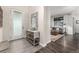 Inviting foyer featuring neutral tones and seamless entry to the cozy living room at 2110 W 67Th Pl, Denver, CO 80221