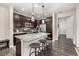 Stylish kitchen with granite countertops, stainless steel appliances, and dark cabinetry at 2110 W 67Th Pl, Denver, CO 80221