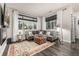 Spacious living room with cozy seating and a modern fireplace, perfect for relaxation at 2110 W 67Th Pl, Denver, CO 80221