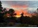 Colorful sunset viewed from yard at 5255 Ridge Trl, Littleton, CO 80123