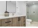 Modern basement bathroom with a walk-in shower at 410 S Vine St, Denver, CO 80209