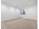 Spacious basement bedroom with neutral carpeting at 410 S Vine St, Denver, CO 80209