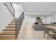 Modern open staircase leading to a finished basement at 410 S Vine St, Denver, CO 80209