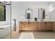 Elegant bathroom with double vanity, soaking tub, and large window at 410 S Vine St, Denver, CO 80209