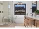 Spa-like bathroom with soaking tub, glass shower, and modern vanity at 410 S Vine St, Denver, CO 80209