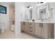 Contemporary bathroom with double vanity and a tub at 410 S Vine St, Denver, CO 80209