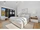 Bright bedroom with large windows and light hardwood floors at 410 S Vine St, Denver, CO 80209