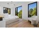 Bright bedroom with large windows and light hardwood floors at 410 S Vine St, Denver, CO 80209