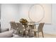 Basement dining area with glass table and modern chairs at 410 S Vine St, Denver, CO 80209