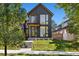 Contemporary two-story house with large windows and a landscaped lawn at 410 S Vine St, Denver, CO 80209