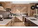 Modern kitchen with white quartz countertops and light wood cabinetry at 410 S Vine St, Denver, CO 80209