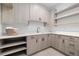 Modern laundry room with built-in cabinets and countertops at 410 S Vine St, Denver, CO 80209