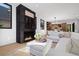 Open living room showcasing a fireplace and view into kitchen area at 410 S Vine St, Denver, CO 80209