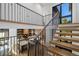 Modern staircase with metal railing and light wood steps at 410 S Vine St, Denver, CO 80209