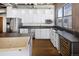 Modern kitchen with stainless steel appliances, white cabinets, and hardwood floors at 2020 Arapahoe St # 1130, Denver, CO 80205