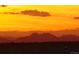 Beautiful sunset with layers of mountains silhouetted in rich orange and red tones at 2020 Arapahoe St # 1130, Denver, CO 80205