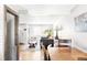 Dining area with hardwood floors and view of the living room at 4191 S Eliot St, Englewood, CO 80110