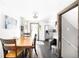 Dining area with hardwood floors and kitchen access at 4191 S Eliot St, Englewood, CO 80110