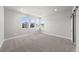 Bright room with large windows and neutral carpet at 8894 Yellowcress St, Littleton, CO 80125