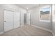 Bedroom featuring closet with sliding doors and window view at 8894 Yellowcress St, Littleton, CO 80125