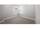 Clean bedroom with neutral carpet, bright window, and base trim at 8894 Yellowcress St, Littleton, CO 80125