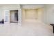 Finished basement with tiled floors, french doors and neutral paint at 13901 E Saratoga Pl, Aurora, CO 80015