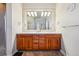 Bright bathroom features a double vanity with granite countertop and updated lighting at 13901 E Saratoga Pl, Aurora, CO 80015