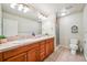 Bathroom featuring dual sinks, a walk-in shower, and modern fixtures at 13901 E Saratoga Pl, Aurora, CO 80015