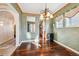 Stylish dining room with hardwood flooring, accented by natural light and sophisticated decor at 13901 E Saratoga Pl, Aurora, CO 80015