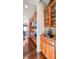 Kitchen with stainless steel appliances and dark hardwood floors at 13901 E Saratoga Pl, Aurora, CO 80015