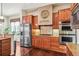 Well-appointed kitchen with wood cabinets and stainless steel appliances at 13901 E Saratoga Pl, Aurora, CO 80015